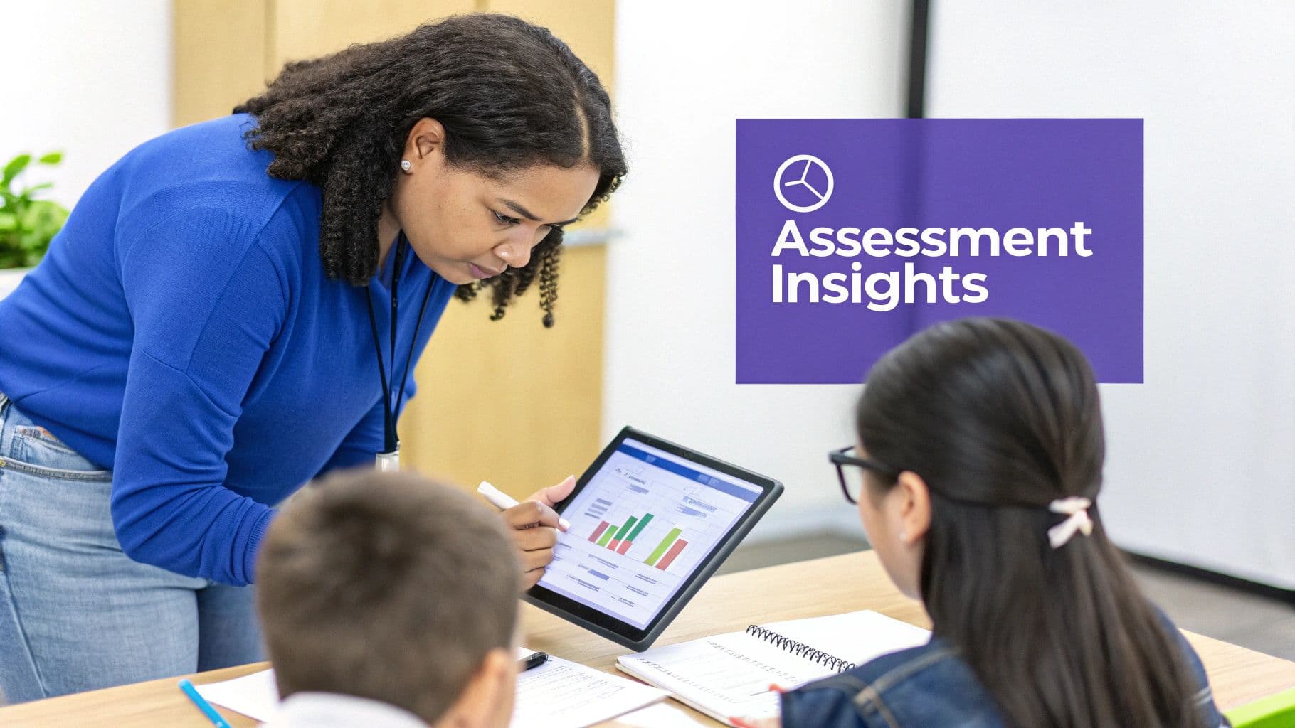 A teacher in a blue shirt shows two students performance insights on a tablet with charts.