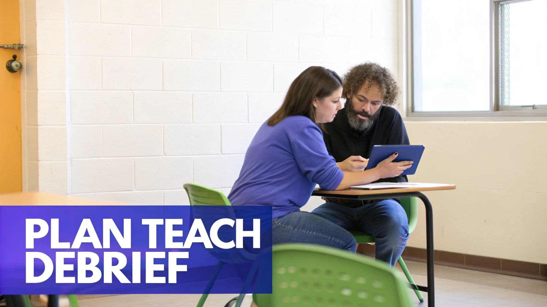 Two educators collaborate, looking at a tablet during an instructional coaching session.