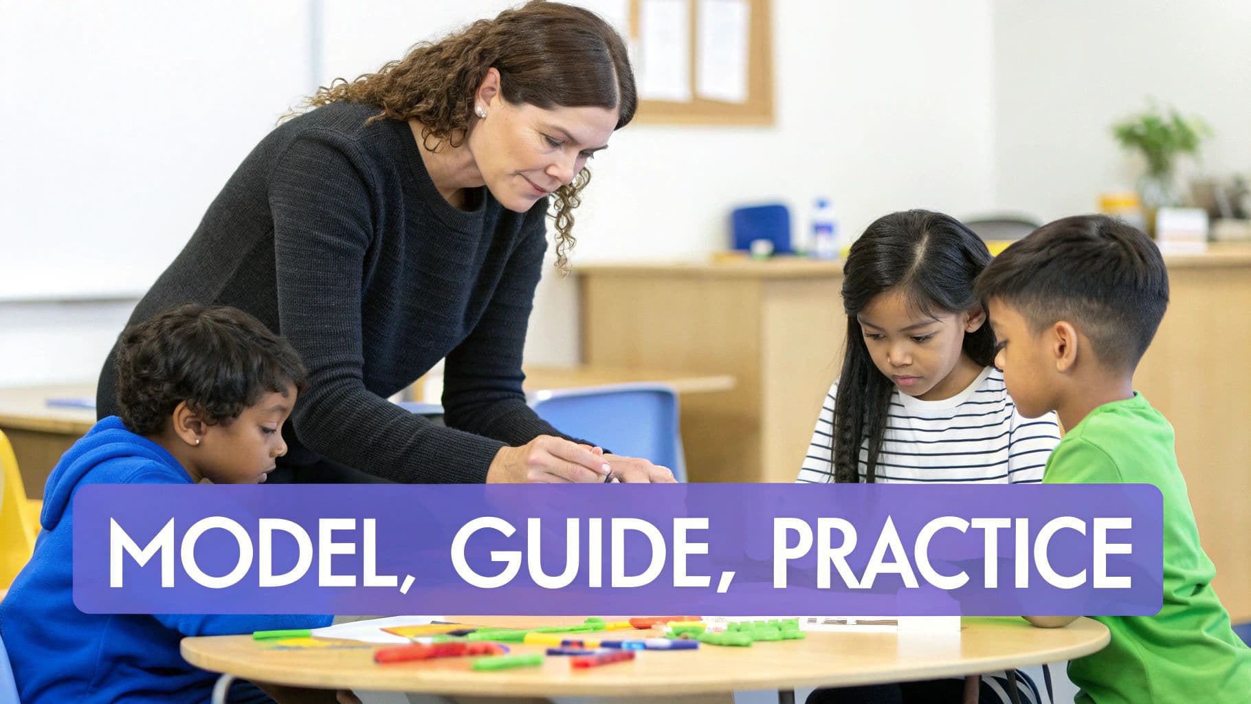 A teacher interacts with three young students at a table during a classroom learning activity.