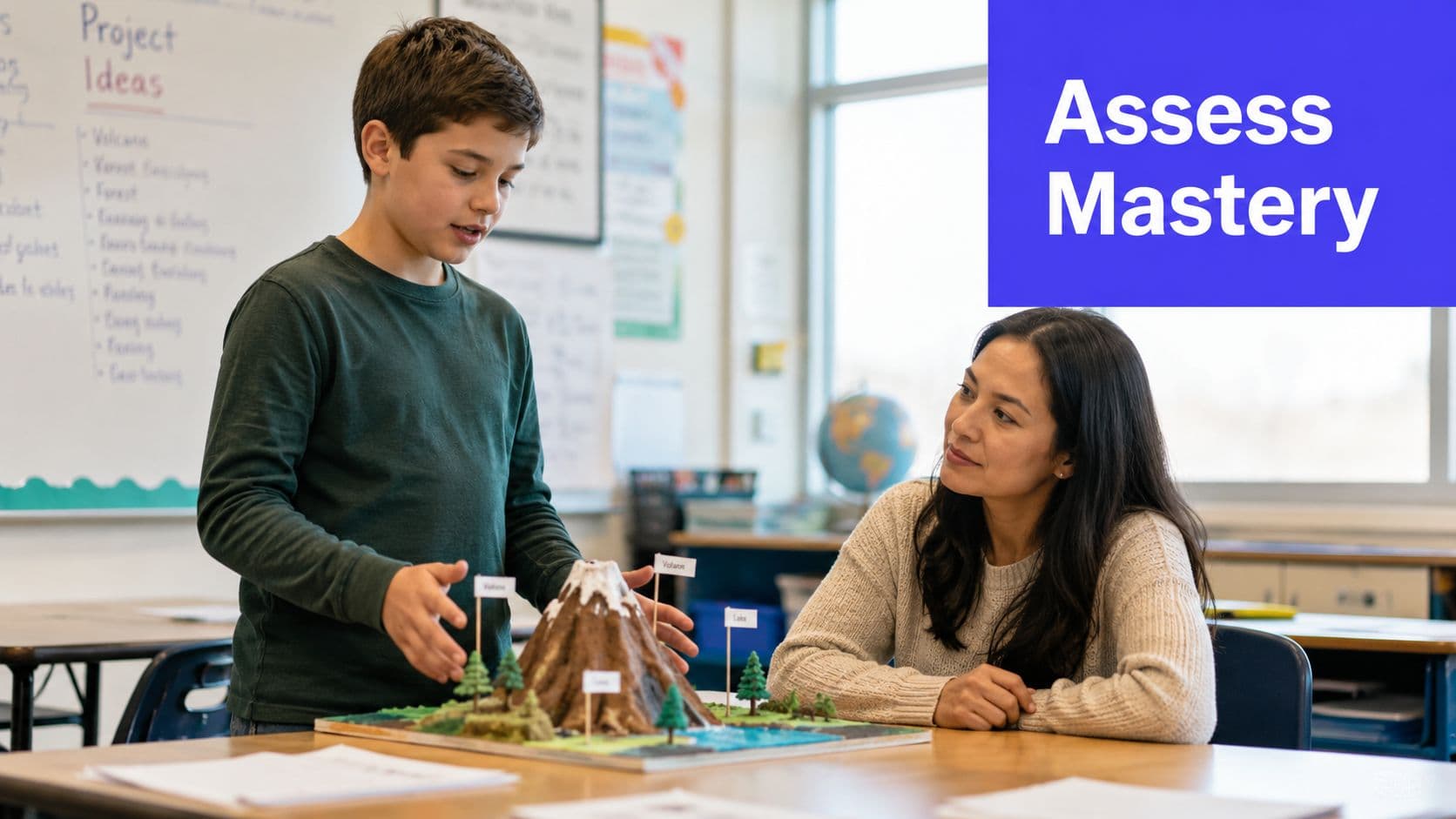 A young student explaining his science fair project volcano model to his teacher in a classroom.