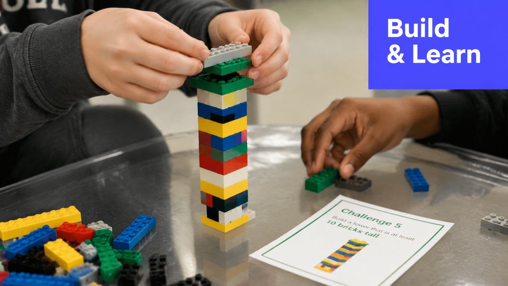 Two children build a tall Lego tower on a table during a classroom learning activity.