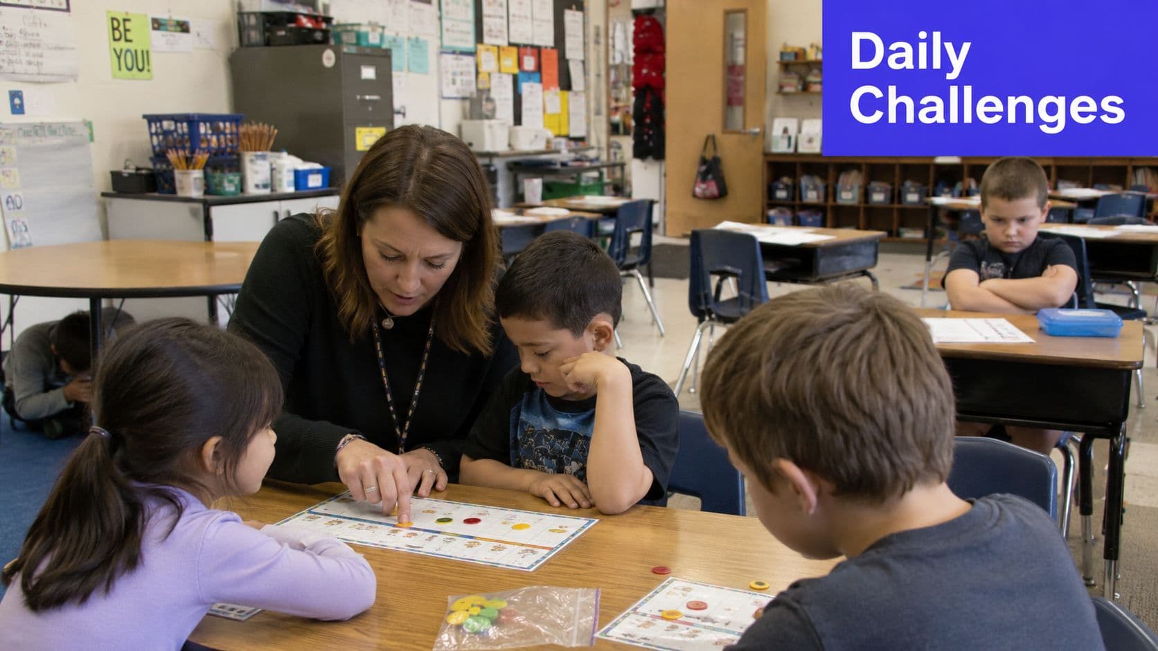A teacher assisting young students with a counting game at a table in a classroom.