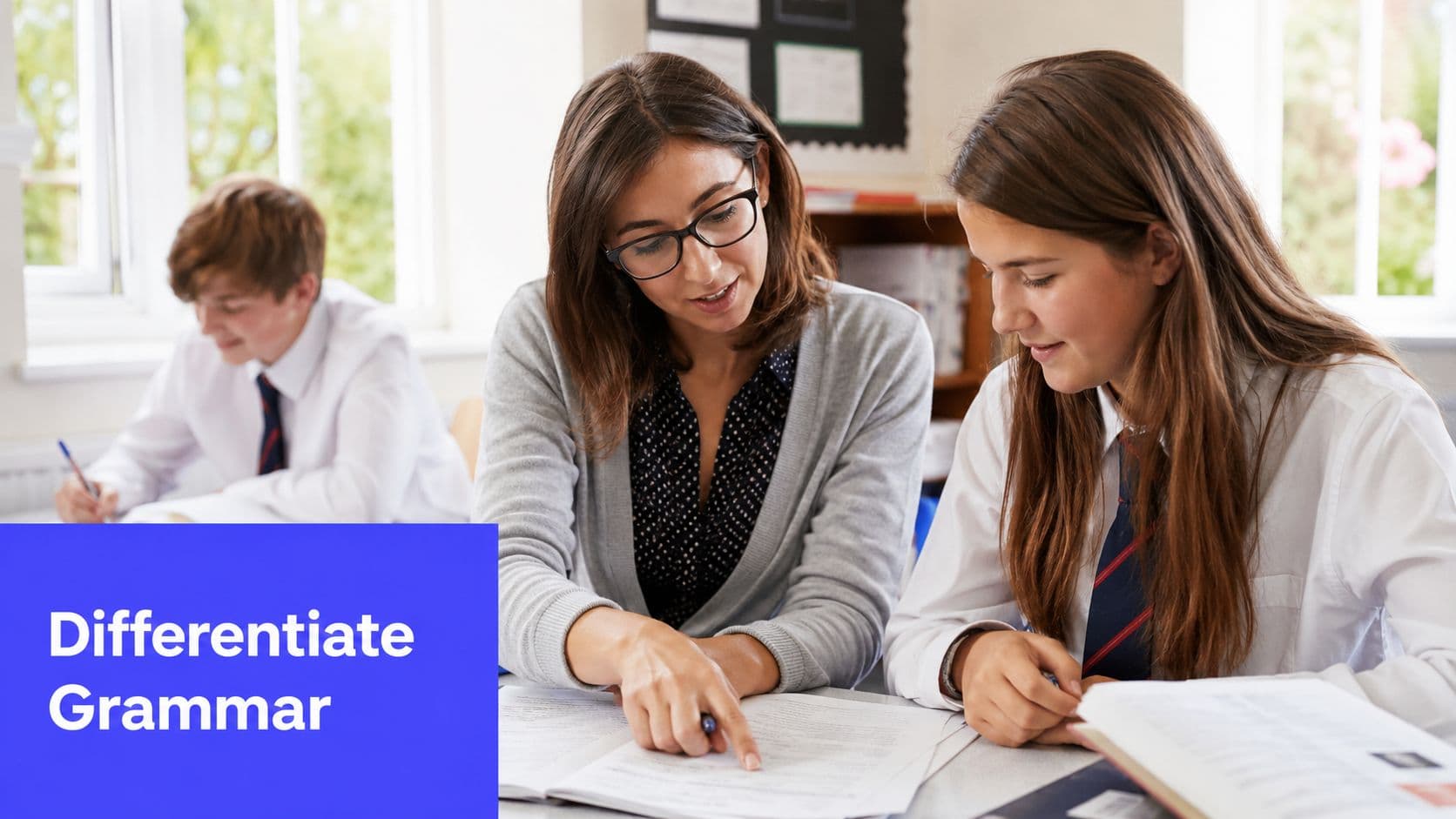 A female teacher helping a student with her classwork in a school classroom setting.